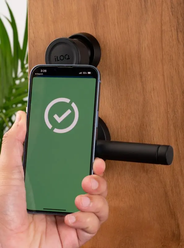 iLOQ ANSI Mortise Cylinder opening with phone.webp